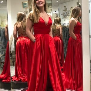 Beautiful Red Prom Dress. New with tags. Crisscross back straps. Pockets